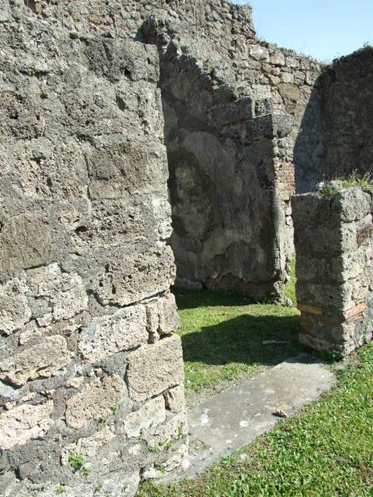 VII.4.57. Pompeii. March 2009. Doorway to Room 5, with small doorway to Room 6 in South wall.