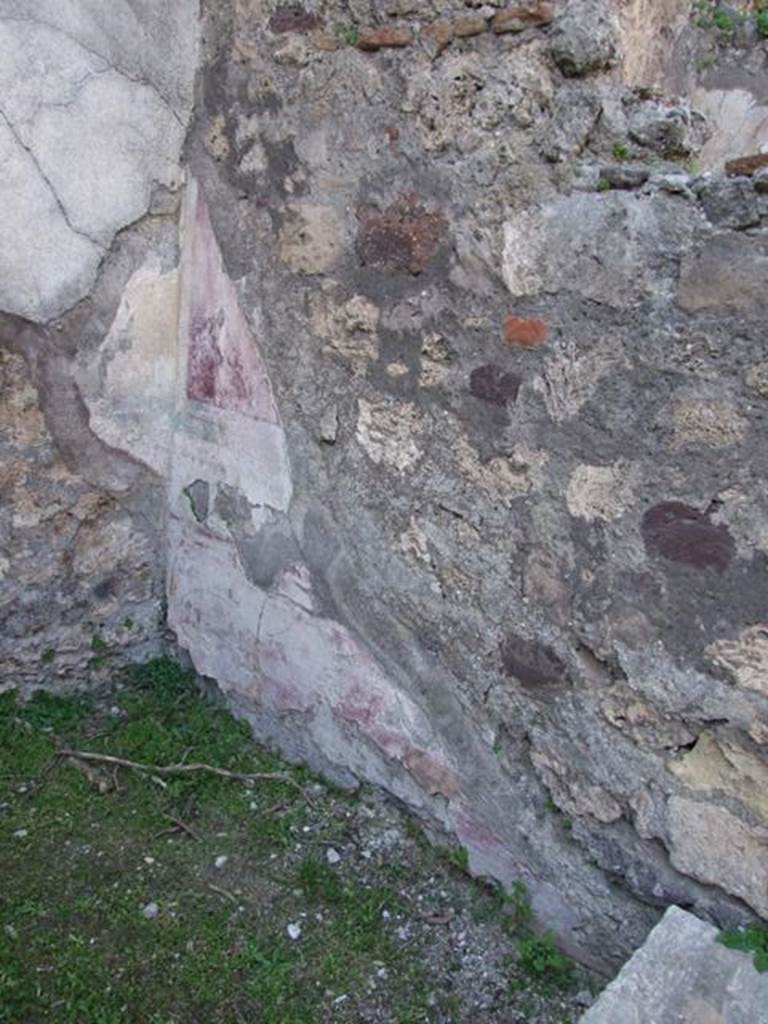 VII.4.57 Pompeii. March 2009.
Room 9, north wall of ala with remaining painted decoration in north-west corner, similar to description from west wall.