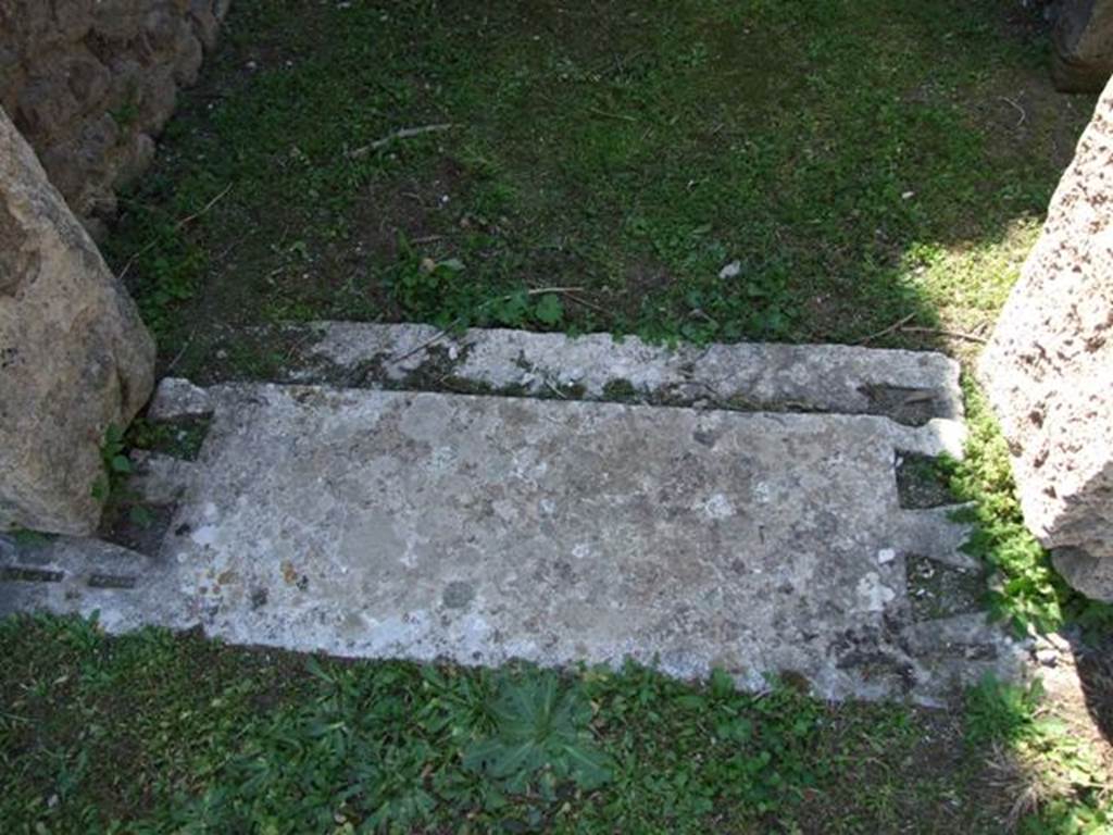 VII.4.57. Pompeii. March 2009. Room 11. Cubiculum. Marble door sill, with slots for door posts.