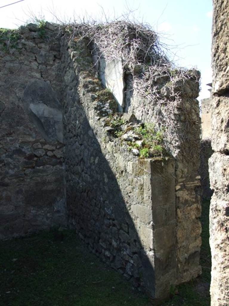 VII.4.57. Pompeii. March 2009. Room 11. Cubiculum. North wall with small doorway to Room 12. Note the double wall with plaster in between.