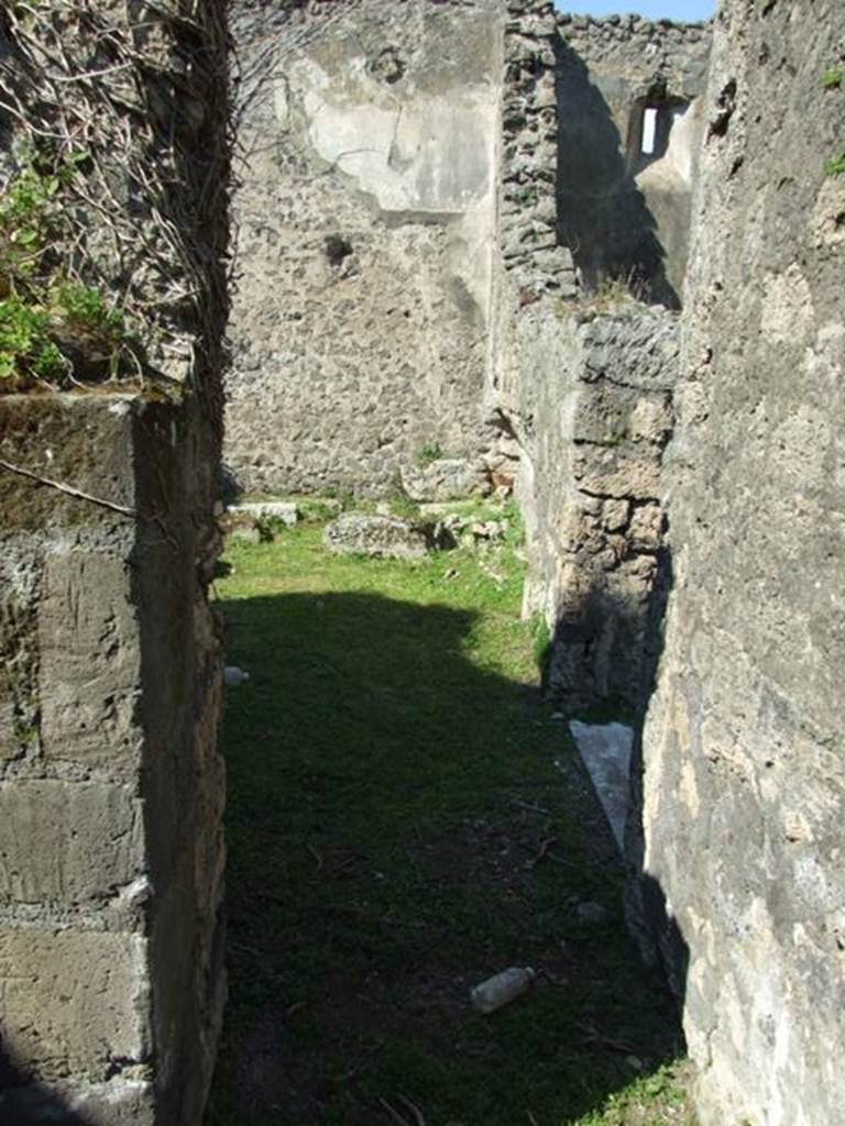 VII.4.57. Pompeii. March 2009. Room 11. Cubiculum. North wall, with small doorway to Room 12.