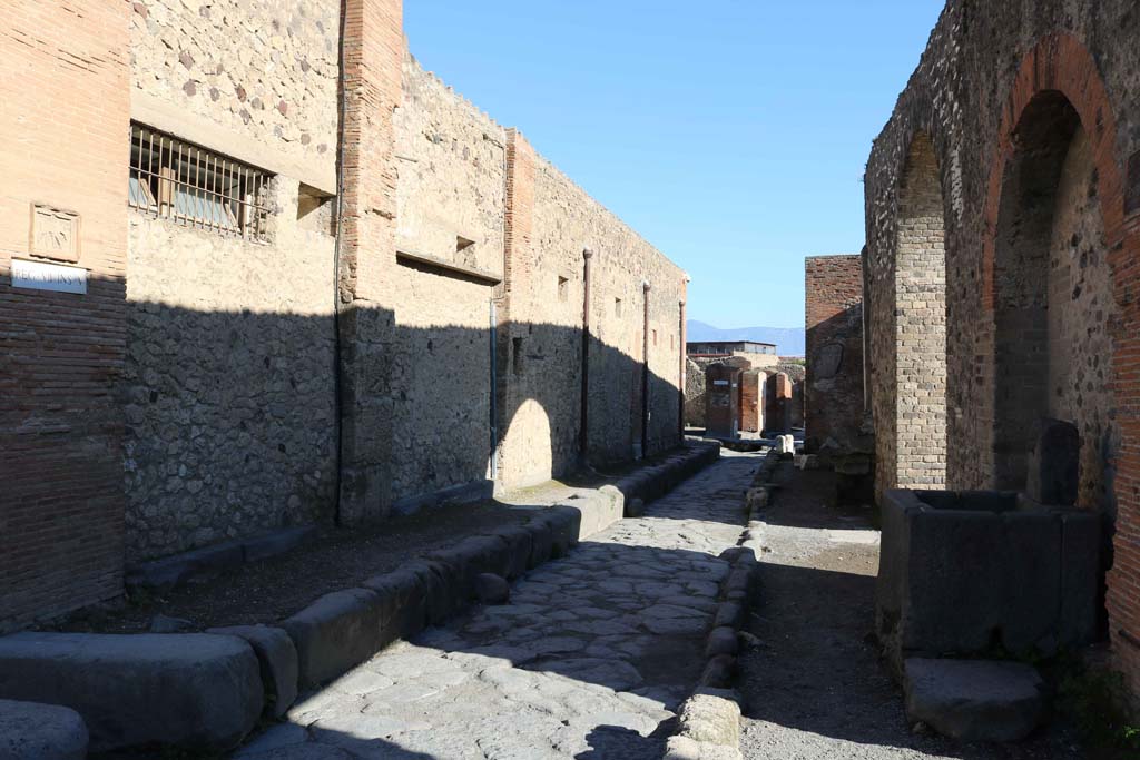 VII.5.14 Pompeii, on left. December 2018.
Looking east on Vicolo dei Soprastanti between VII,5, on left and VII.8, on right. Photo courtesy of Aude Durand.