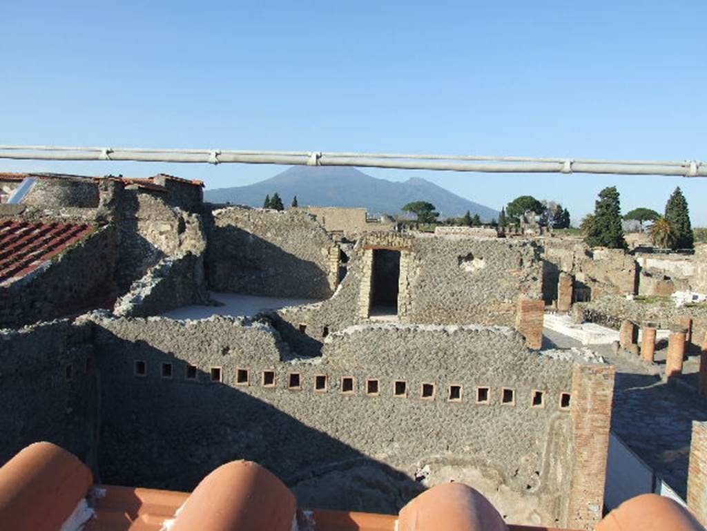 VII.5.19 Pompeii. December 2007.
View looking north across Forum Baths to Vesuvius from roof of new restaurant.
According to Fiorelli, the west side of the insula contained a number of large shops with an upper floor, between them was the entrance to the Forum Baths. Although the shops did not have any particular merit to their construction, many rich objects were found some of which fell from the upper floors. See Pappalardo, U., 2001. La Descrizione di Pompei per Giuseppe Fiorelli (1875). Napoli: Massa Editore. (p.96)