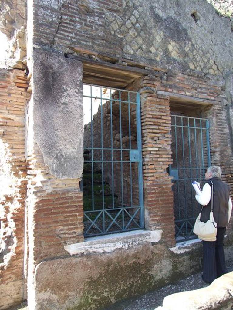 VII.6.18 Pompeii. March 2009. Entrance on Vicolo delle Terme, together with doorway to VII.6.17. Between VII.6.16 and VII.6.17 are three large water storage reservoirs that feed the Forum Baths. VII.6.17 gives access to the lower part of the reservoirs. VII.6.18 gives access to the upper part of the reservoirs. It is estimated the reservoirs held 430,000 litres of water.