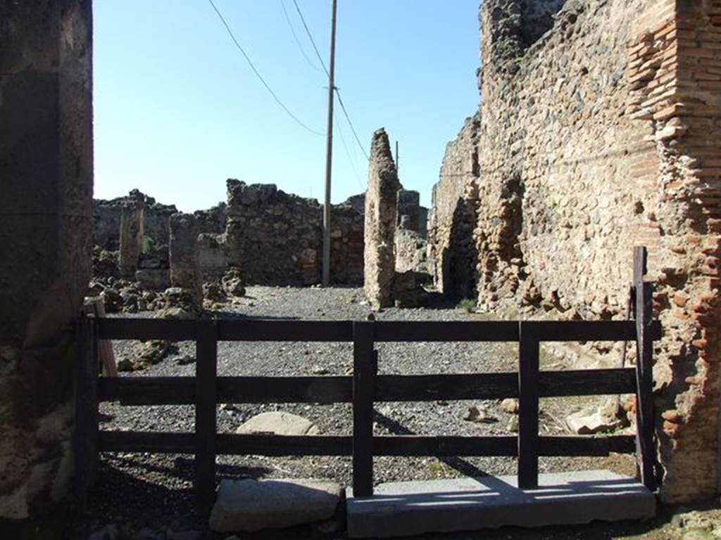 VII.6.19 Pompeii. March 2009. Looking west across workshop to rear.
According to Garcia y Garcia, this was very devastated and ruined following the September 1943 bombing, together with VII.6.20.
See Garcia y Garcia, L., 2006. Danni di guerra a Pompei. Rome: L’Erma di Bretschneider. (p.102).
According to Della Corte, because of the considerable quantities of colouring materials and pigments found here, he considered it the workshop of an unknown and unnamed Negotiator Pigmentarius.
See Della Corte, M., 1965. Case ed Abitanti di Pompei. Napoli: Fausto Fiorentino. (p.173)