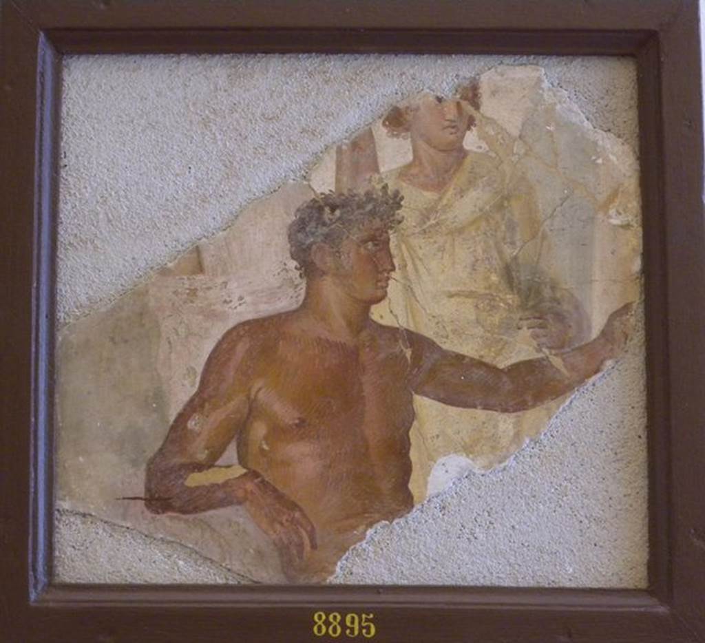 VII.6.28 Pompeii. Found on 10th April 1762. Painting of two figures, one a naked man with a crown of flowers on his head.
Now in Naples Archaeological Museum. Inventory number 8895.
See Antichità di Ercolano: Tomo Quarto: Le Pitture 4, 1765, 47, 231.
See Helbig, W., 1868. Wandgemälde der vom Vesuv verschütteten Städte Campaniens. Leipzig: Breitkopf und Härtel, (1167).