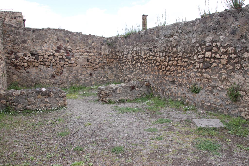 VII.7.1 Pompeii. May 2024.
Looking towards north-east corner of shop-room, with doorway in north wall to rear room. Photo courtesy of Klaus Heese.