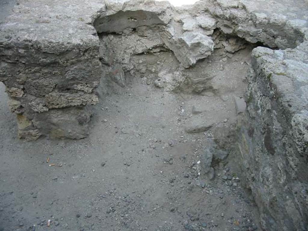 VII.7.9 Pompeii. May 2003. Looking towards rear of two-sided counter, where there would have been two dolia embedded into the counter. Photo courtesy of Nicolas Monteix.