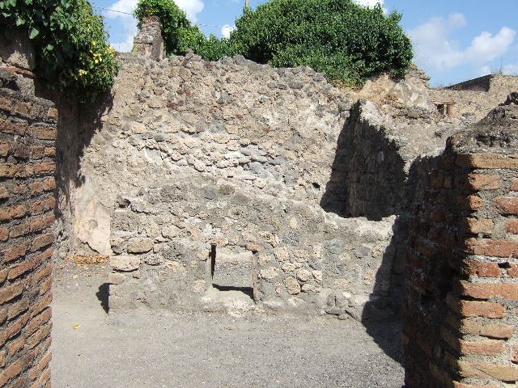 VII.7.9 Pompeii. September 2005.
Looking through doorway of stairs at VII.7.8, into south-east room and rear room of VII.7.9.