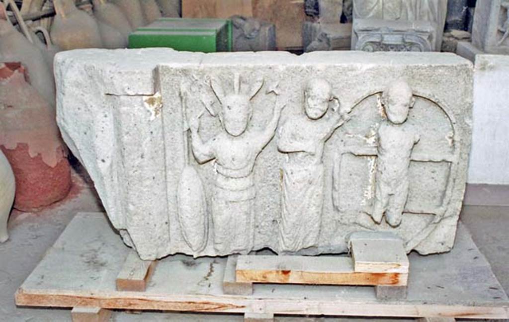 VII.7.29 Pompeii. October 2001. The only surviving metope (an architectural element from a frieze) from VIII.7.31 the Doric Temple, showing the punishment of Ixion on the wheel. Now in storage in the VII.7.29 Forum Granary Store. Photo courtesy of Peter Woods.
See Dobbins, J. J. and Foss, P. W., 2008. The World of Pompeii. Oxford: Routledge. (p. 78).