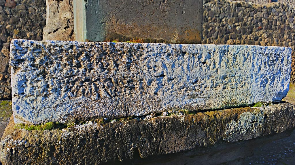 VII.7.32 Pompeii. December 2019.
Looking west to inscribed stone at base of statue of Artemis. Photo courtesy of Giuseppe Ciaramella.