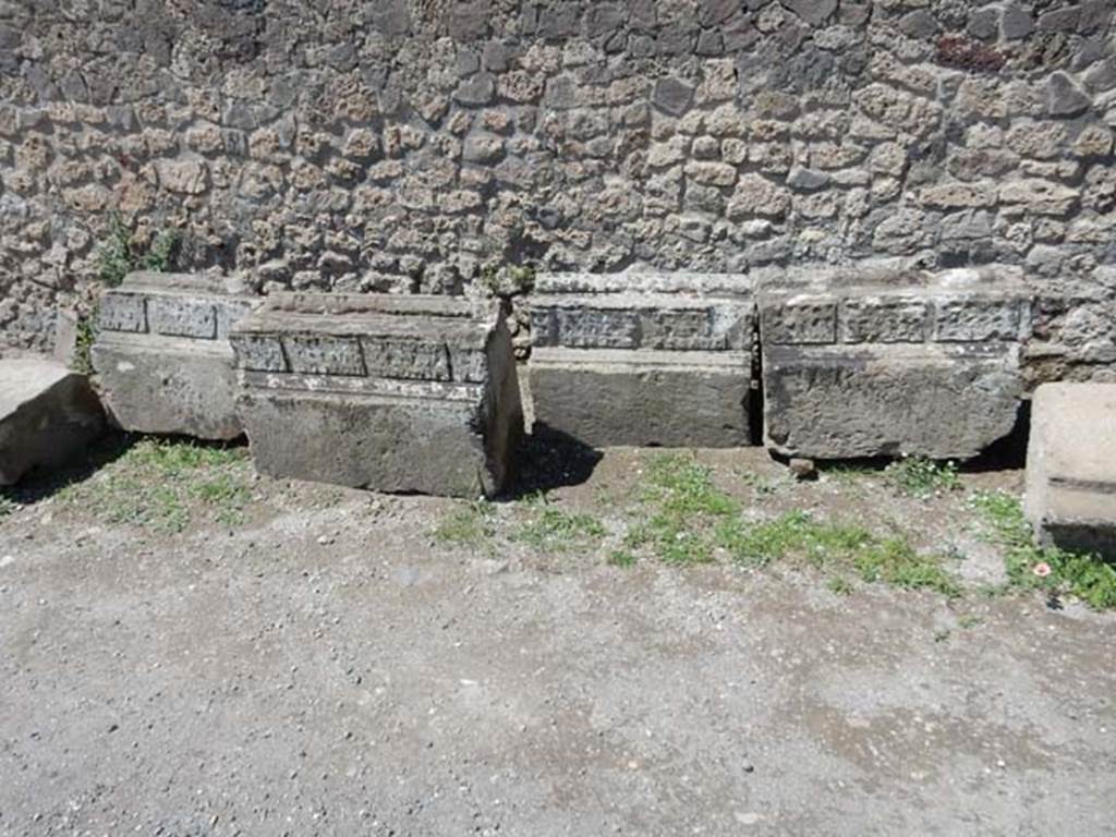 VII.7.32 Pompeii. May 2018. Remains of stones with decoration from the Temple, against the west wall.
Photo courtesy of Buzz Ferebee.