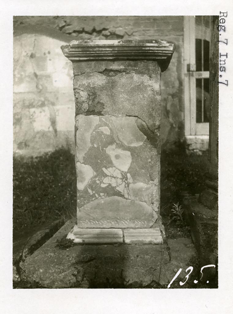 VII.7.32 Pompeii. Pre-1937-39.
Looking north to statue base, presumably in north-east corner with doorway in rear north wall.
Photo courtesy of American Academy in Rome, Photographic Archive. Warsher collection no. 135.