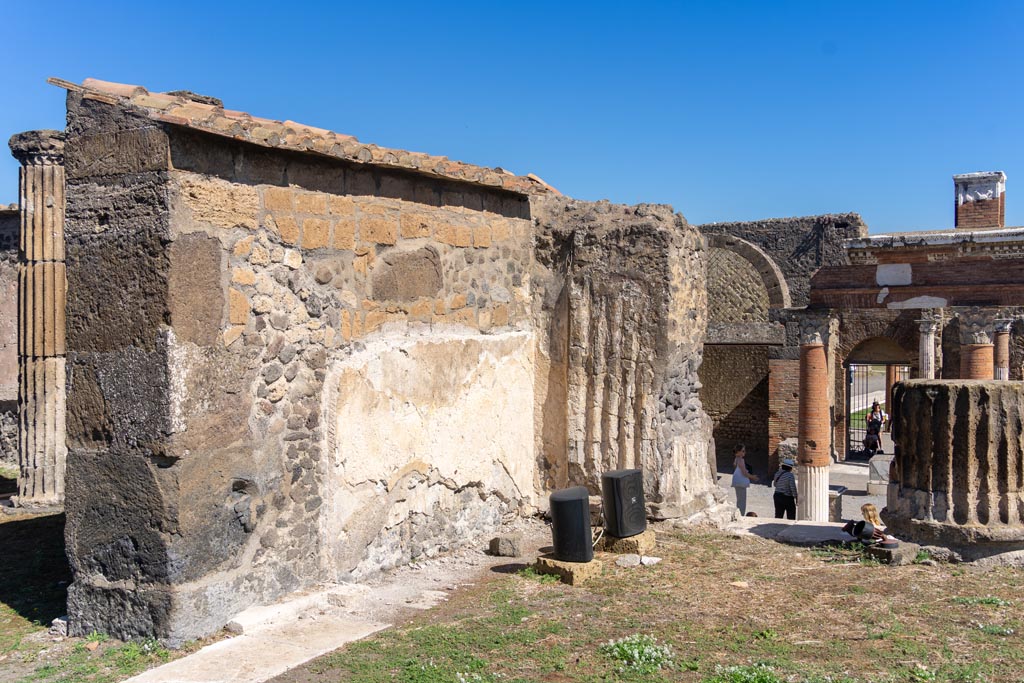 VII.8.1 Pompeii. October 2023.
Looking north-east along exterior wall on east side of Temple doorway. Photo courtesy of Johannes Eber.