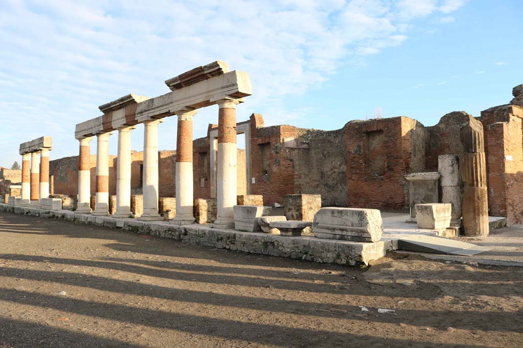 VII.9.1 Pompeii. December 2108.
Looking north-east across Forum towards the portico in front of Eumachia’s building, with junction to Via dell’Abbondanza, on right.
Photo courtesy of Aude Durand.