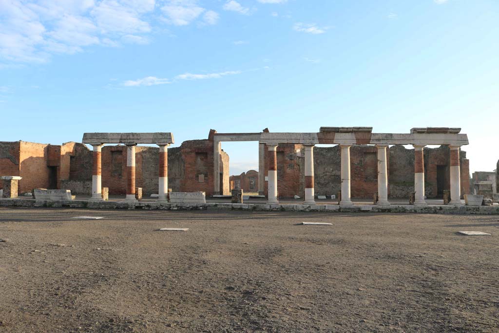 VII.9.1 Pompeii. December 2018.
Looking east across Forum towards portico, and entrance doorway to Eumachia’s Building. Photo courtesy of Aude Durand.