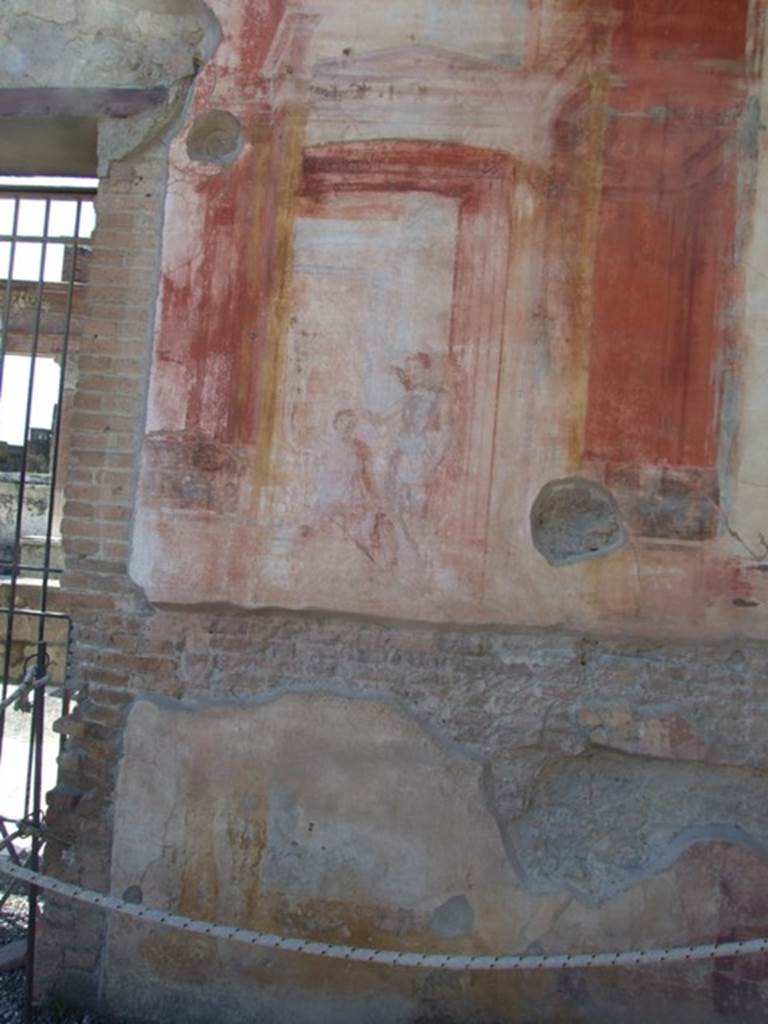 VII.9.7 and VII.9.8 Pompeii. Macellum. March 2009.
North-west corner, west wall, north side of doorway. Wall painting of Victory crowning a warrior?