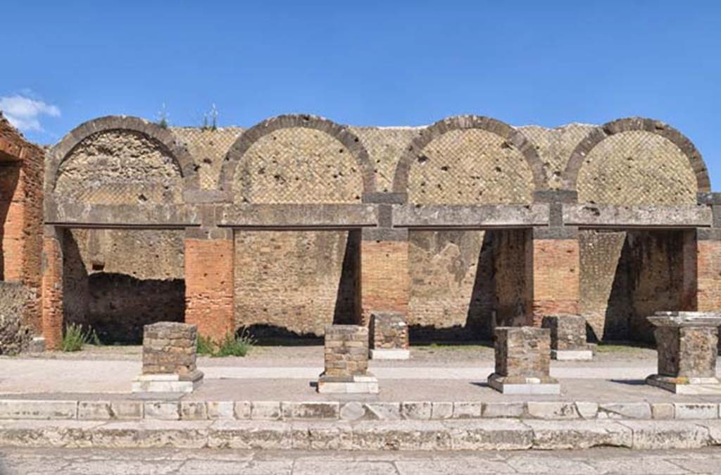 VII.9.9 Pompeii, on right. April 2018. Looking east towards exterior facades of shops at VII.9.12/11/10 and 9. Photo courtesy of Ian Lycett-King. Use is subject to Creative Commons Attribution-NonCommercial License v.4 International.
