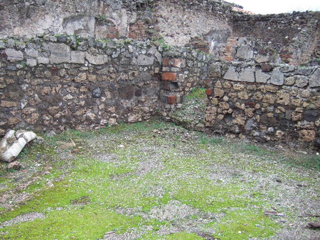 VII.9.36 Pompeii. December 2005. North-west corner and doorway leading to latrine, under stairs to upper floor at VII.9.35