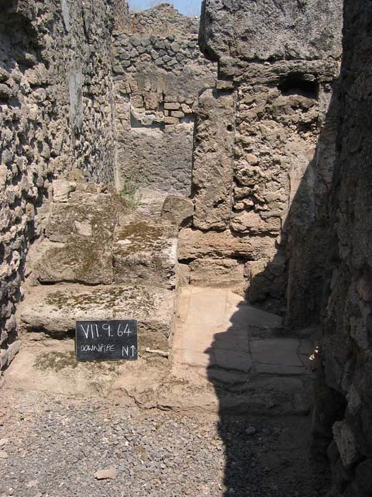 VII.9.64 Pompeii. July 2005. Looking north. Photo courtesy of Barry Hobson.
According to Hobson when writing �next door to VII.9.63 a new entrance from the street was made. This gave access via a staircase to the upper storey, and to the right of the stairs another new latrine was constructed.  This was now back to back with the one in VII.9.63 and emptied into the same cesspit. In addition the staircase led to an upper storey latrine, the down pipe from which was inserted into the wall. The provision here of three latrines leads one to ask who used each of them?�.  
See Hobson, B., 2009. Latrinae et foricae: Toilets in the Roman World. London; Duckworth. (p.68)

