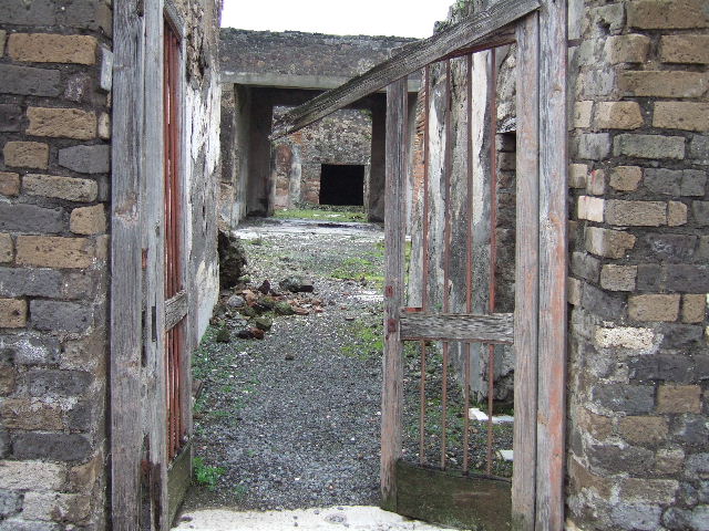VII.10.3 Pompeii. December 2005. Atrium 3 with remains of impluvium and mosaic floor.