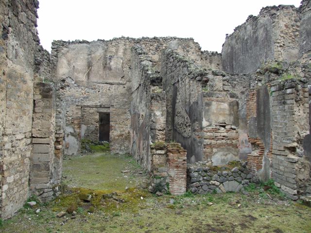 VII.11.14 Pompeii. March 2009. Garden “C”, two small niches on west wall at the north end. According to Boyce, in the same wall to the right of the lararium were set two smaller arched niches. He could not prove whether one or both of these niches had served as a shrine. He thought it was possible that they may have originally been built as lararia and then later been replaced by the large one, described above.
See Boyce G. K., 1937. Corpus of the Lararia of Pompeii. Rome: MAAR 14. (p.70, no.311) 
