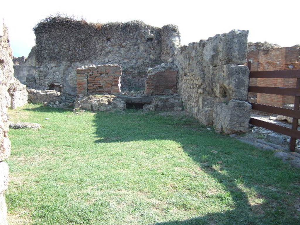 VII.2, Pompeii. December 2004. Via degli Augustali looking east.     VII.12.1   