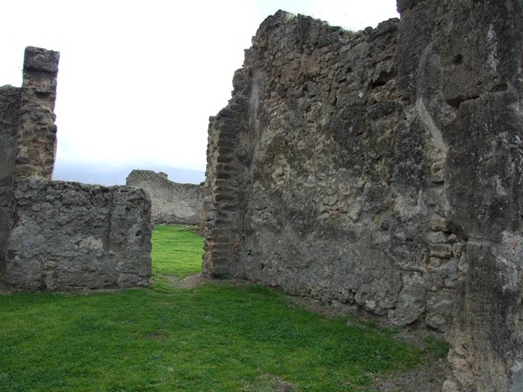 VII.12.4 Pompeii. December 2007. West wall and doorway in south wall to atrium of VII.12.3.