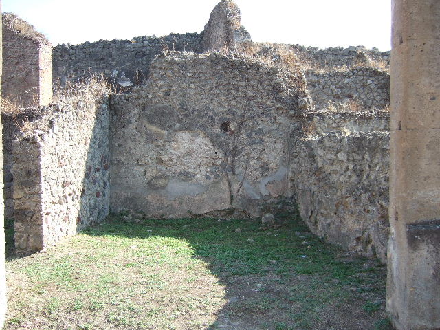 VII.12.8 Pompeii. September 2005. Interior of north-west corner of shop.

