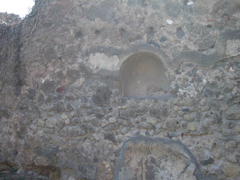 VII.12.12 Pompeii. September 2005. Niche in west wall of shop-room.
According to Boyce, above the counter on which the articles for sale were displayed, was an arched niche. Fiorelli described this as “la nicchia de’ Penati” Fiorelli, Scavi, 19; Descr., 283.
See Boyce G. K., 1937. Corpus of the Lararia of Pompeii. Rome: MAAR 14. (p.70, no.317)