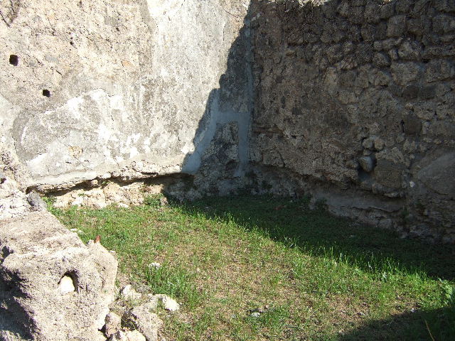 VII.12.13 Pompeii. September 2005. Hearth on east wall.