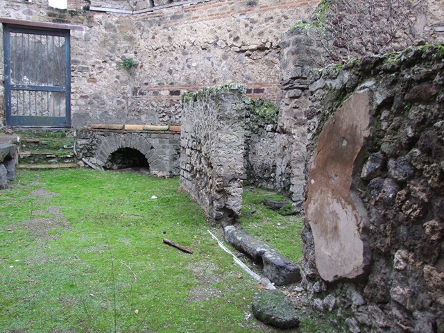 VII.12.17 Pompeii. December 2005. Looking east towards room on north side, taken from VII.12.21.

