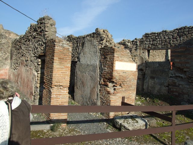 VII.12.26 Pompeii. December 2004. Entrance corridor and doorway to shop at VII.12.27, on left.