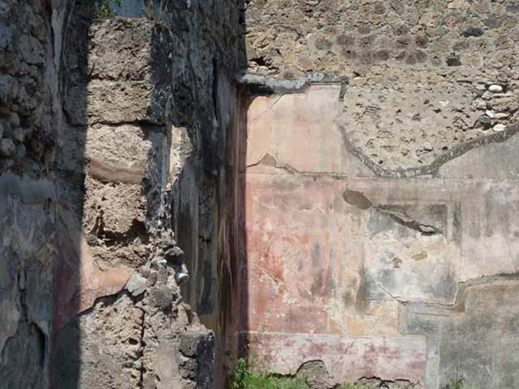 VII.12.26 Pompeii. May 2010. West wall of triclinium, north- west corner and north wall.