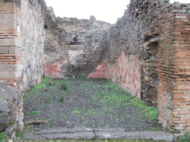 VII.12.27 Pompeii. December 2007. Area on west side outside the entrance, remains of plaster.