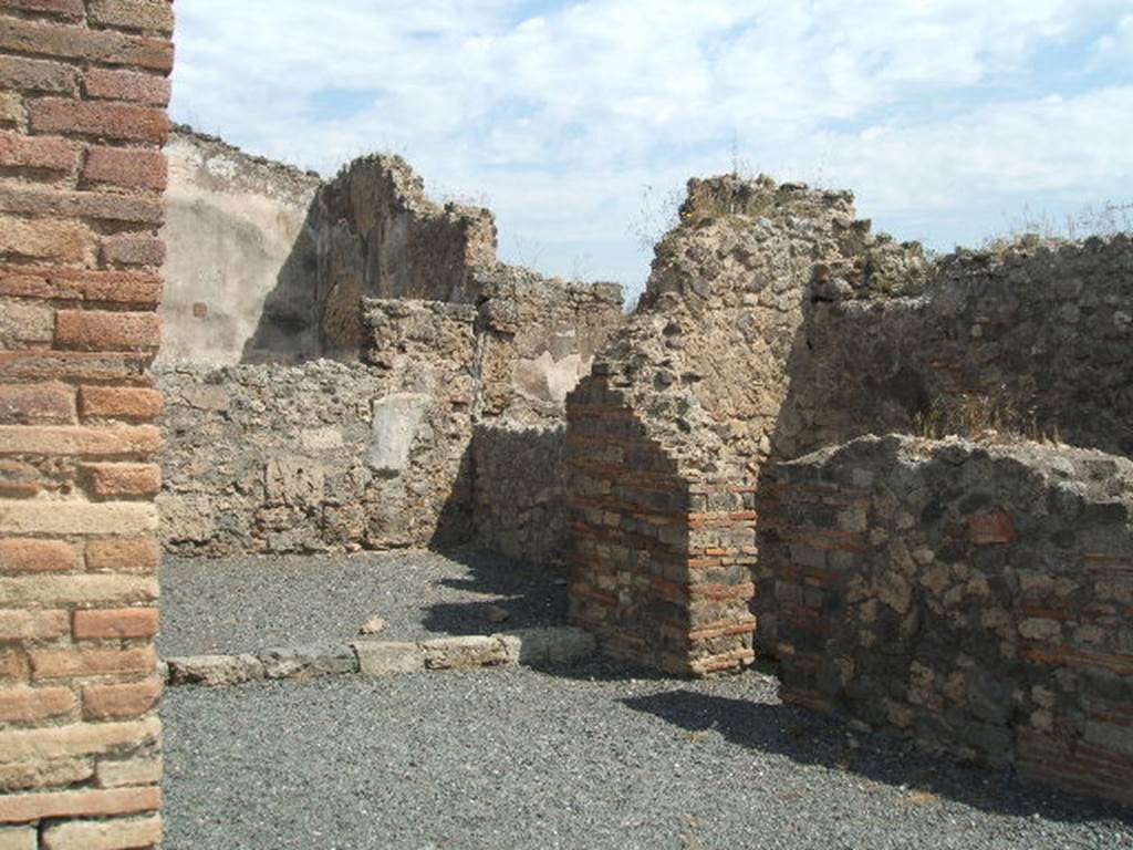 VII.14.6 Pompeii. December 2005. West wall of shop and rear room.