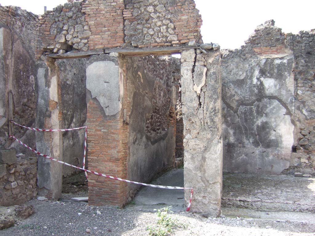 VII.15.8 Pompeii. September 2005. Steps to upper floor in south-west corner of atrium.