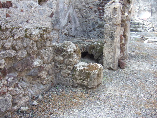 VII.15.9 Pompeii. September 2005. South-west corner of rear room, with plastered west wall.