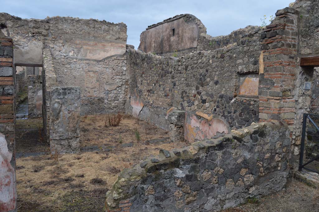 VII.15.12 Pompeii. March 2018. 
Looking north-east from garden area, across to room described by Boyce as “central atrium-like room”.
According to Eschebach, it was a triclinium. 
Foto Taylor Lauritsen, ERC Grant 681269 DÉCOR.

