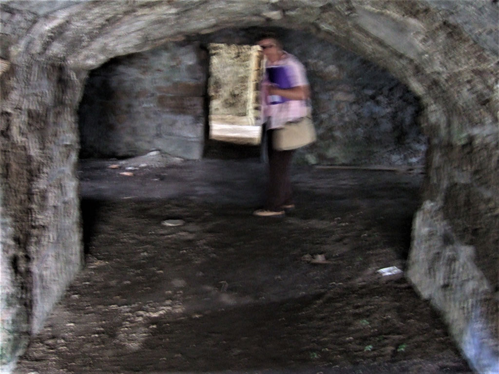 VII.15.16 Pompeii. May 2006. South end of corridor A, leading into open space I, on left, and H. on right.
In the centre of the photo is the narrow entrance leading to rooms K, L, and other storerooms on south side.