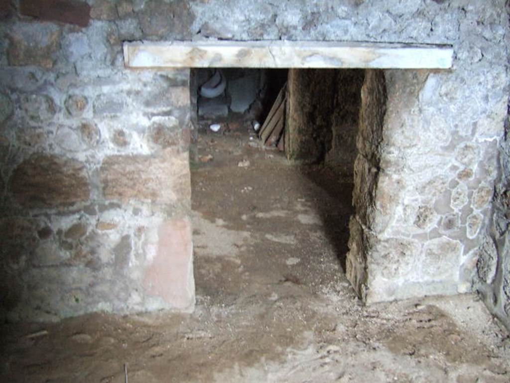 VII.15.16 Pompeii. May 2006. Granary. Room F, looking towards doorway in east wall to corridor A, looking across to room G.