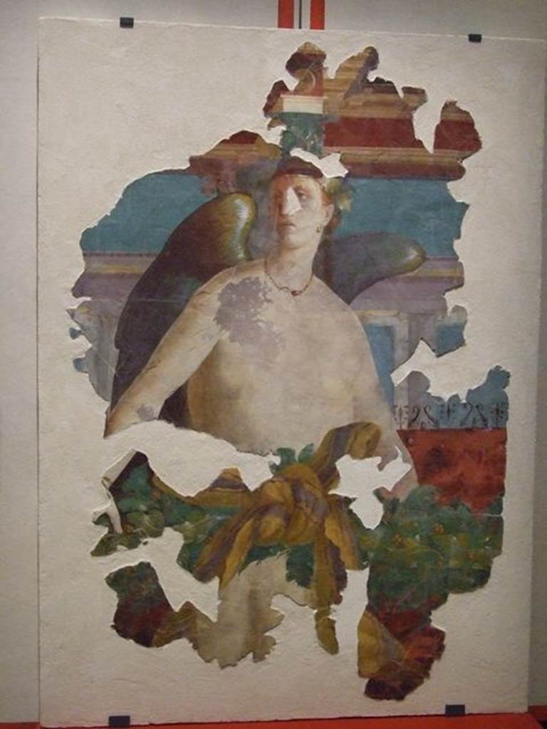 VII.16.17-22 Pompeii. Wall painting of winged female figure, possibly Victoria. PAP 41653. 
Photographed at �A Day in Pompeii� exhibition at Melbourne Museum. September 2009.
This may have come from the area of oecus 32 and may be the II style winged Nike.
This room has not been photographed.
Or, VI.17.41 Pompeii, according to PPM �
�This painting has been wrongly attributed to the tablinum of VI.17.41, the pieces recomposed from numerous fragments and shows a flying female Genius. The characteristics of the figure do not seem to agree with the recognisable remains from the north wall of the tablinum, therefore one must think that the fragments had been found in this area during the excavation in the 1950�s and perhaps belong to the decoration of oecus 15 in the south-west of the house at VI.7.41, or of triclinium 20 in the north-west corner of the same house.�
See Carratelli, G. P., 1990-2003. Pompei: Pitture e Mosaici. VI. (6). Roma: Istituto della enciclopedia italiana, (p.20, no.22/23.)


