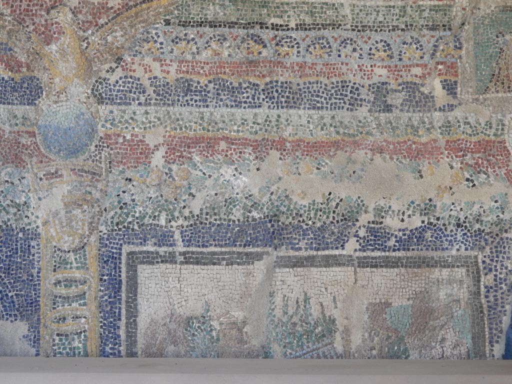 VII.16.a Pompeii. May 2018. Second mosaic fragment belonging to the suburban baths now in VII.7.5.
Lower section decorated on the left with a tripod on which is a globe surmounted by an eagle. At the bottom is a landscape.
Photo courtesy of Buzz Ferebee.