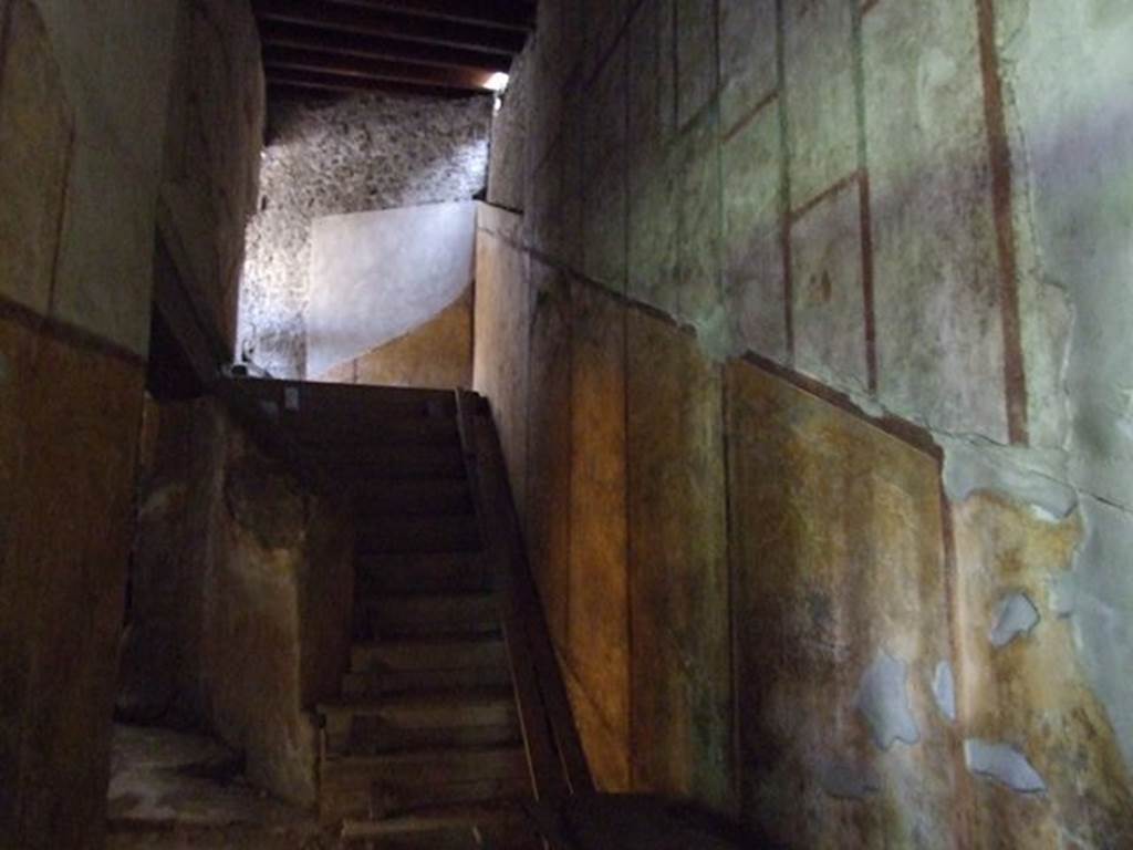 VII.16.a Pompeii. December 2006. Corridor D with stairs to upper floor, leading to corridor 15, latrine, praefurnium, and rear service rooms. Looking north-east.