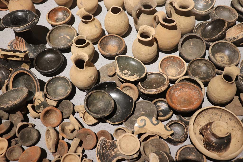 VIII.1.4 Pompeii. February 2021. Santuario extraurbano del Fondo Iozzino. 
Terracotta votive offerings: miniature chalices and small cups, small jugs and statuettes.
Photo courtesy of Fabien Bi�vre-Perrin (CC BY-NC-SA).
