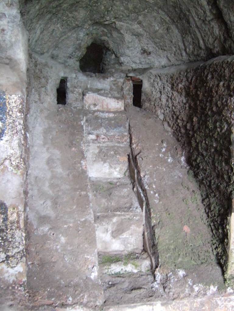 VIII.2.28 Pompeii. May 2006. Water stair of nymphaeum. On either side of the water source were small windows or recesses that may have served for special lighting effects.
See Richardson, L., 1988. Pompeii: an Architectural History. Baltimore: John Hopkins University Press. (p.231-2).