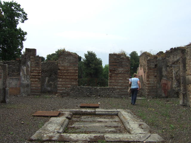VIII.2.39 Pompeii. May 2006. East side of atrium with doorways to rooms e, f and g.