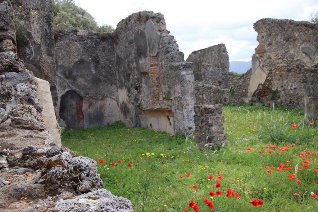 VIII.3.21 Pompeii. May 2024.
Looking south-east over wall in VIII.3.24 towards triclinium (6), on left, and room (4), on right. Photo courtesy of Klaus Heese.