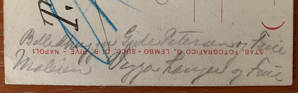 Note on the side of the front of the 1899 postcard which appears to identify the people in the drawing.

The phrase on the left-hand side of the address side “Billedhugger Gyde Petersen og Frue” translates as “The sculptor Gyde Petersen and wife”.
Hans Gyde-Petersen was baptised 26th December 1862 as Hans Gyde Pedersen but later changed his name to Hans Gyde-Petersen.
His sculpture won him a grant to study in Italy from 1897 to 1899. 
During these years in Italy, he turned his back on a promising career as a sculptor and returned to his first love of landscape painting.
He was part of the Skagen artists group on the northern tip of Denmark.
He was knighted by the Danish King in 1910. 
He died in Denmark in 1943.

Underneath is what looks like: "Maleren Viggo Langer og Frue” (the painter Viggo Langer and wife). 
Viggo Langer was a Danish artist. 
Born Viggo Hansen on Nov. 11th 1860 in Reudnitz (by Leipzig, Germany), died Oct.11 1942 in Rungsted, Denmark.
His father was Danish and moved the family back to Copenhagen in 1864.
He adopted his mother's family name Langer in 1885 to avoid confusion with another painter, an artist known as Viggo Hansen.
At auction on October 2, 1998 was a signed painting of his titled “Aftenstemning ved Pompeij (Evening scene in Pompeii)” on which are the words "Pompeij 1899", which would seem to confirm his presence at the time of this postcard.

Who drew the sketch is not known but possibly it was another Danish artist who was in Italy in 1899?
