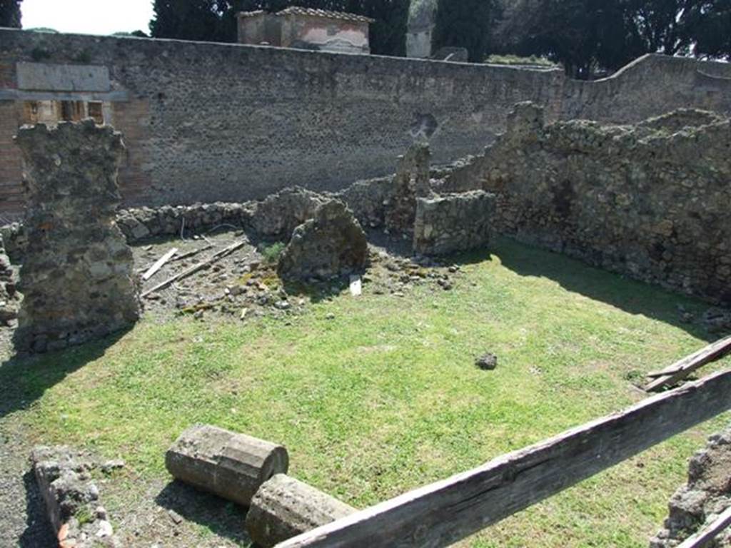 VIII.4.27 Pompeii. March 2009. Looking south from south portico of VIII.4.15, onto lower level. The remains of one of the four columns of VIII.4.15 (?) is lying on the grass, which would have been the peristyle area belonging to VIII.4.27. VIII.4.27�s rear entrance at VIII.4.29 is on the south side of peristyle.  According to Boyce, in this peristyle high up on the north wall was an arched niche.
See Boyce G. K., 1937. Corpus of the Lararia of Pompeii. Rome: MAAR 14. (p.76).
According to Jashemski, 
�The garden at the rear of the house had a portico on the east supported by two columns. 
There was an arched niche high up on the north wall. A passageway at the south-west corner at the rear of the garden led to the street, directly across from the Temple of Isis�.
See Jashemski, W. F., 1993. The Gardens of Pompeii, Volume II: Appendices. New York: Caratzas. (p.214).

 


